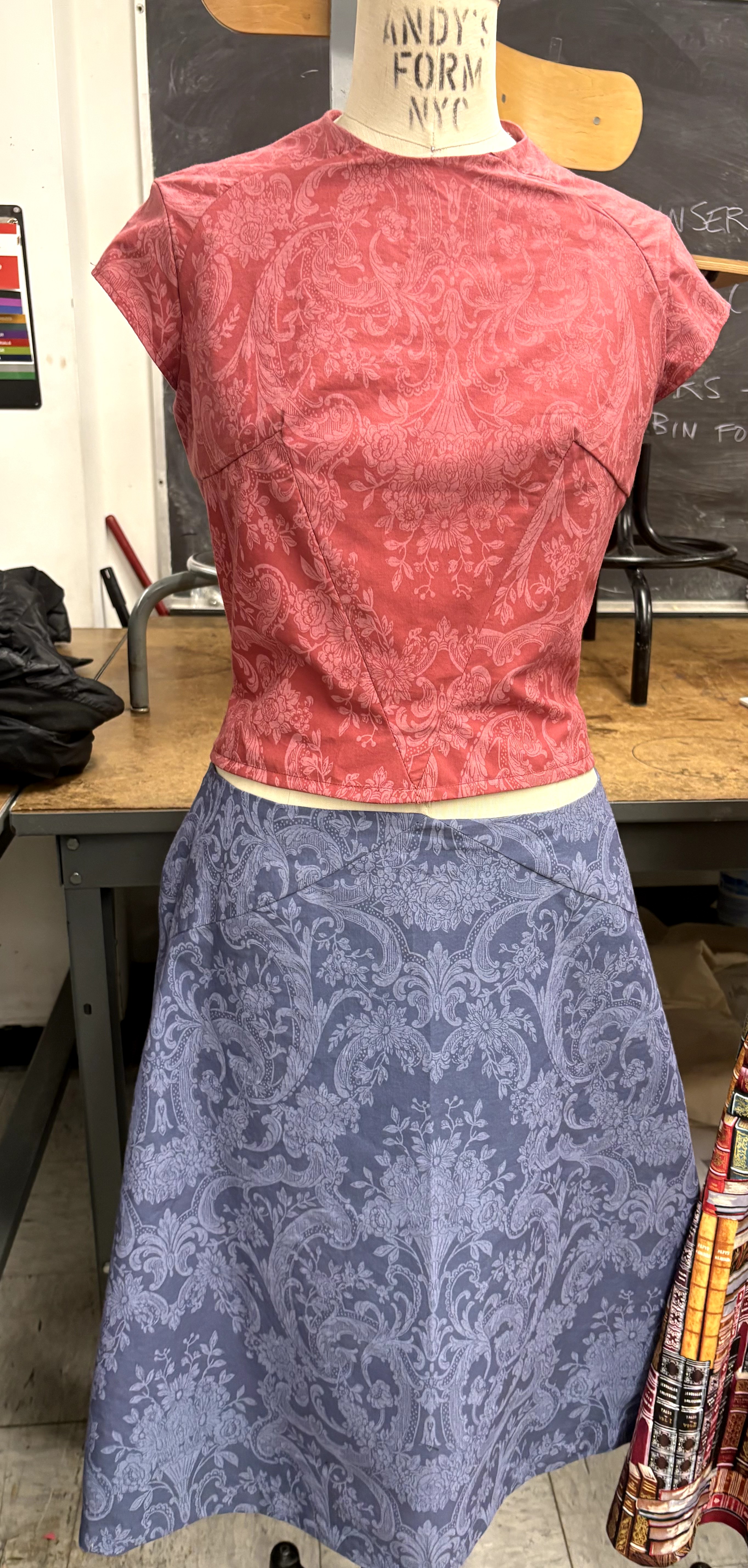 Red paisley top and navy skirt, front