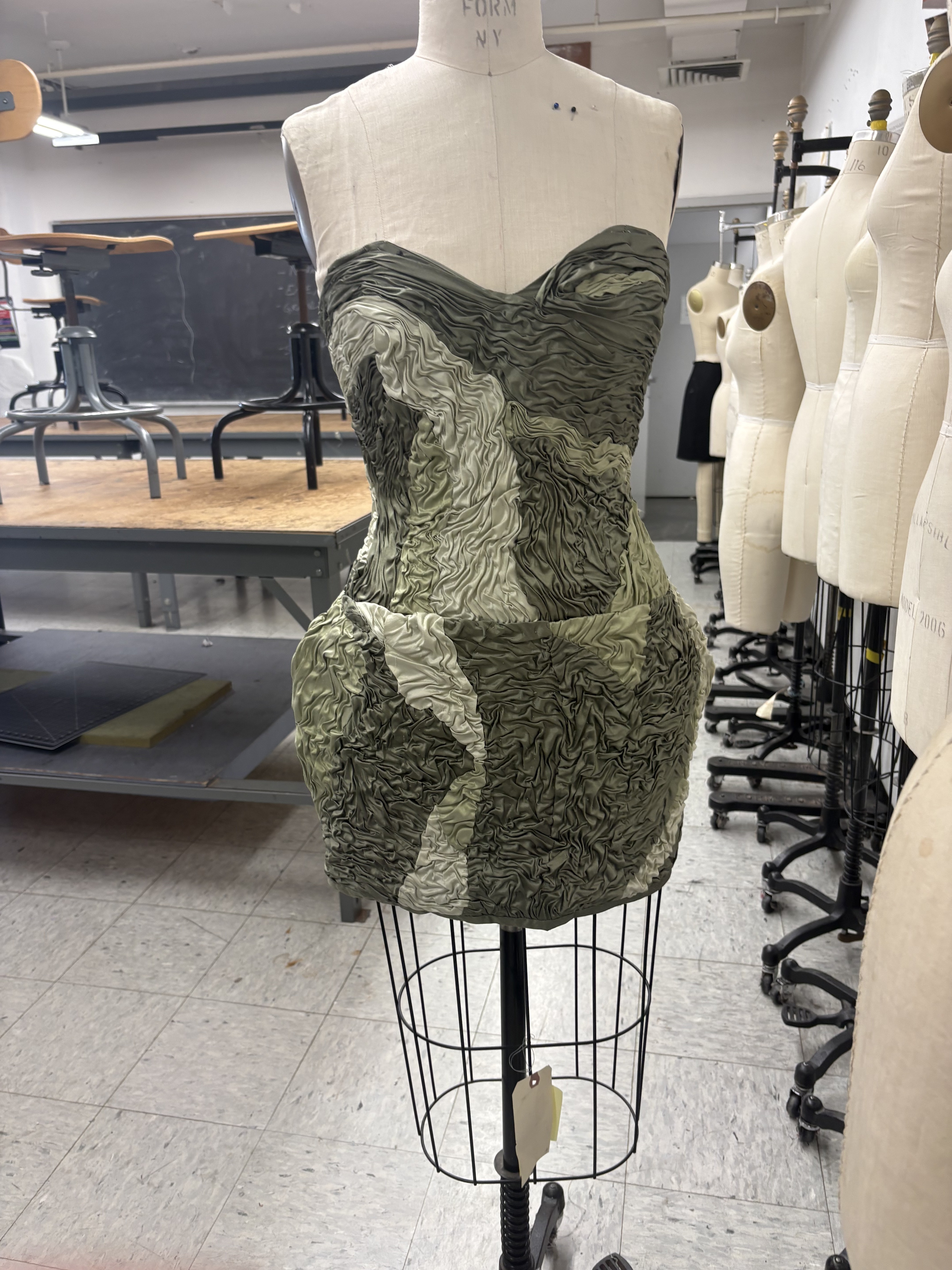 Green ruched dress on the form