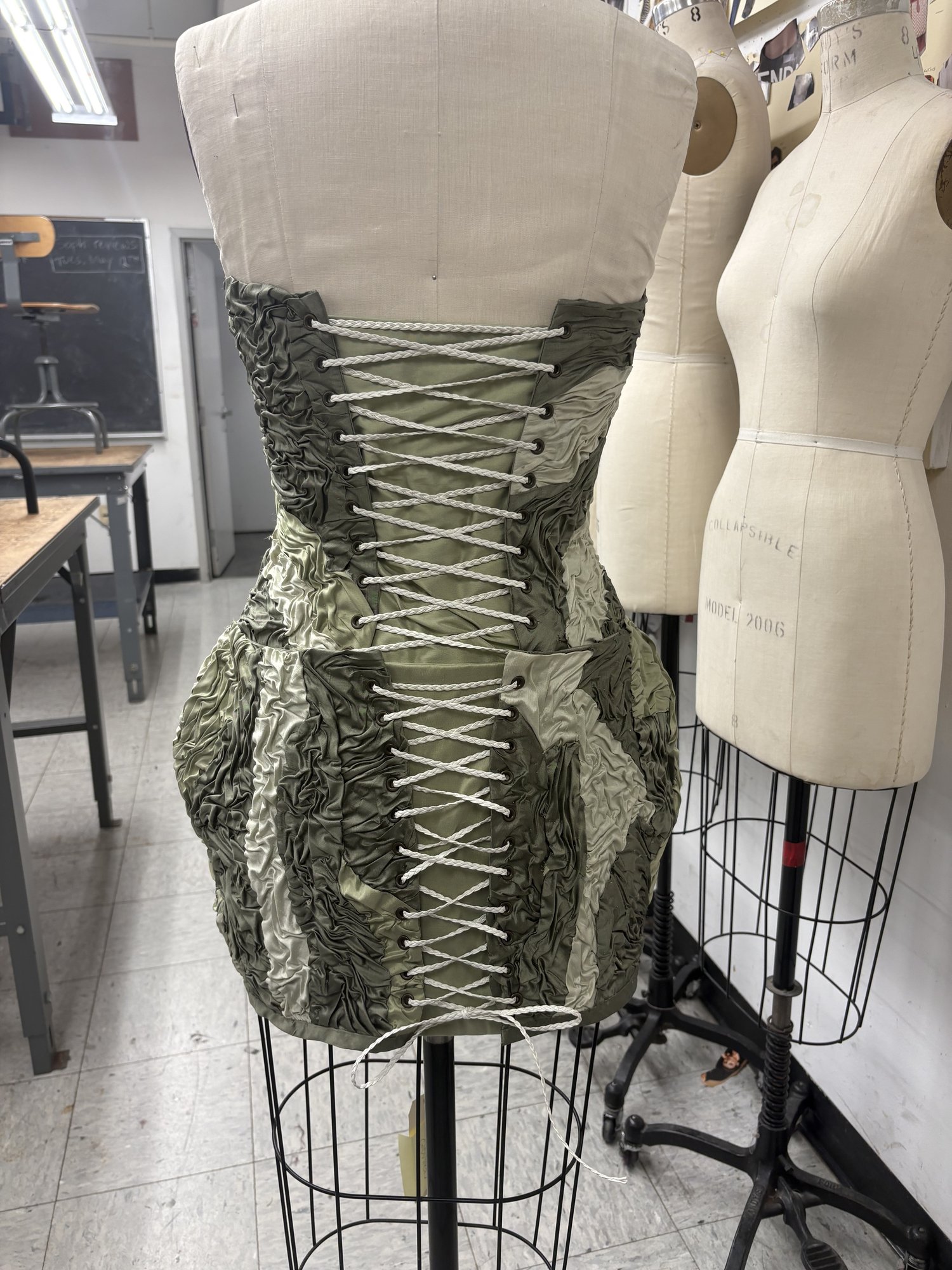 Green ruched corset dress, laced back